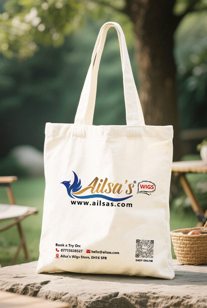 Ailsas canvas tote by a sunlit picnic blanket, packed with fresh bread and wine - its 34x38x10cm capacity easily holding picnic essentials while maintaining sleek style.