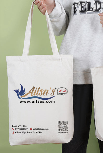 Urban chic: Model carries Ailsas 34x38x10cm tote with laptop and groceries, demonstrating how its structured shape maintains form even when partially filled.