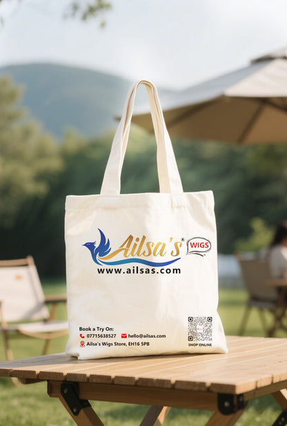 Ailsas shopping bag brimming with organic produce, its wide handles comfortably distributing weight across the forearm.