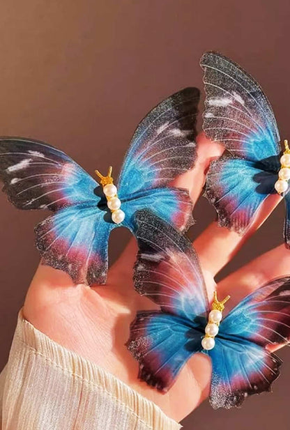 Flight of fancy: Ailsas kinetic butterfly clip features spring-loaded wings that flutter with movement, creating Instagram-worthy hair moments.