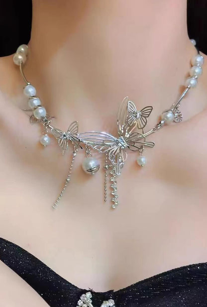 Ailsas baroque pearl butterfly necklace with titanium filigree features 5cm swaying fringe, ideal for deep-V wig styles.