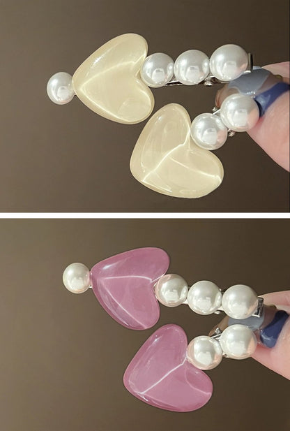 Ailsas glow-pearl clips emit soft light via 0.5mm luminescent coating, securing bangs discreetly.