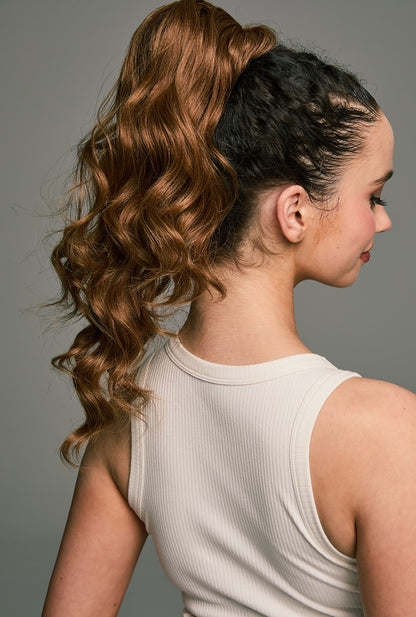 Jamie by Ailsa's Wigs – Brown synthetic ponytail with body wave texture, viewed from behind to showcase length and flowing motion.