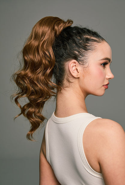 Jamie by Ailsa's Wigs – Brown wrap-around ponytail extension with soft body waves, shown from back-right angle for a natural, voluminous finish.