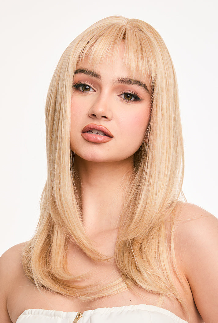 Front office-ready style of 20" Eilis wig by Ailsa's Wigs with professionally blended blonde tones and air bangs