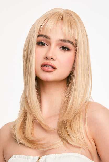 Front office-ready style of 20" Eilis wig by Ailsa's Wigs with professionally blended blonde tones and air bangs