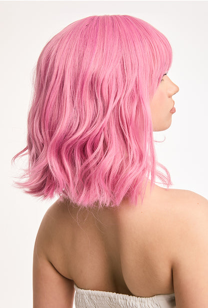 Voluminous right-back view of Petal curly wig by Ailsa's Wigs featuring 3D honeycomb curl technology