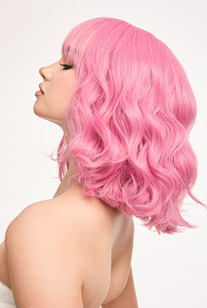 12" springy cherry blossom curls in motion, left side view of Petal pink wig by Ailsa's Wigs showing natural bounce
