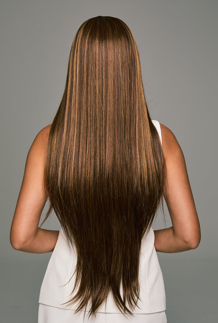 Back view of Lucy long straight wig - 32-inch smooth strands with honey blonde highlights flowing elegantly