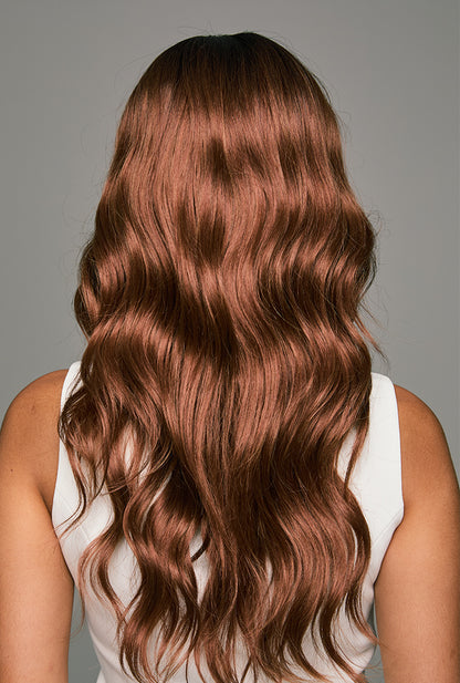 Back view of Camila by Ailsa's Wigs shows 20-inch curls with consistent wave pattern and anti-frizz shine from crown to ends.