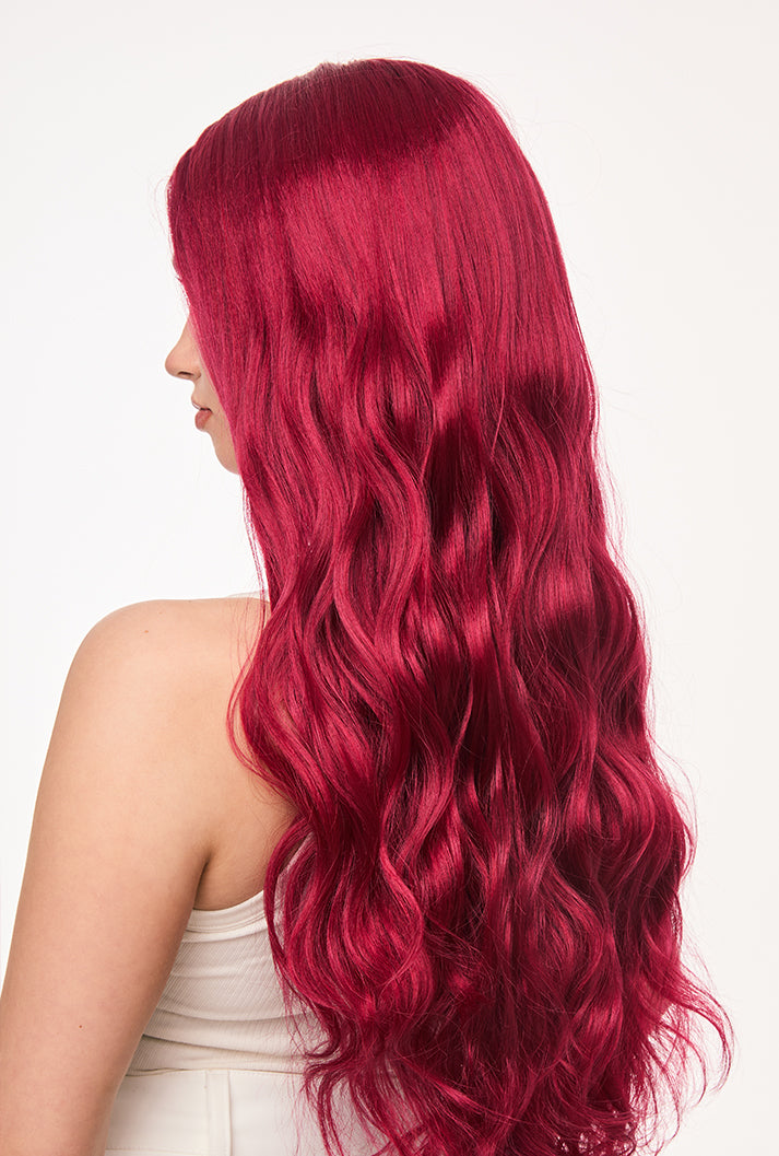 From behind, Scarlett by Ailsa's Wigs is pure drama - 26-inch body waves cascade down like a crimson waterfall, with each curl maintaining perfect definition even in motion, thanks to advanced fiber memory technology.
