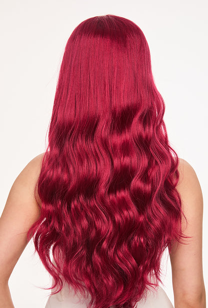 Backstage view of Scarlett wig by Ailsa's Wigs showcases the uniform wave pattern from crown to ends, with luminous red strands that resist frizz and maintain mirror-like shine without daily styling.