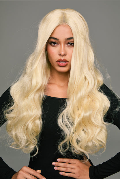 Chameleon beauty: Arya by Ailsa's Wigs showcases its transformative color palette - shifting from winter morning frost to summer champagne gold as the light dances across each meticulously crafted wave.