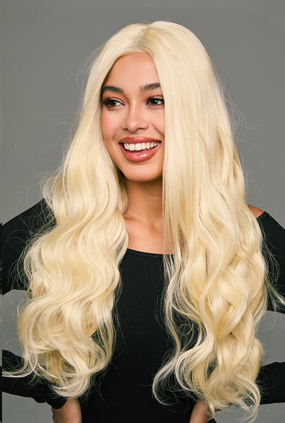 Arya platinum blonde wig by Ailsa's Wigs cascades in 26-inch liquid-metal waves, each strand hand-polished to mirror-like perfection, creating a mesmerizing waterfall of cool-toned brilliance that commands attention in any professional setting.