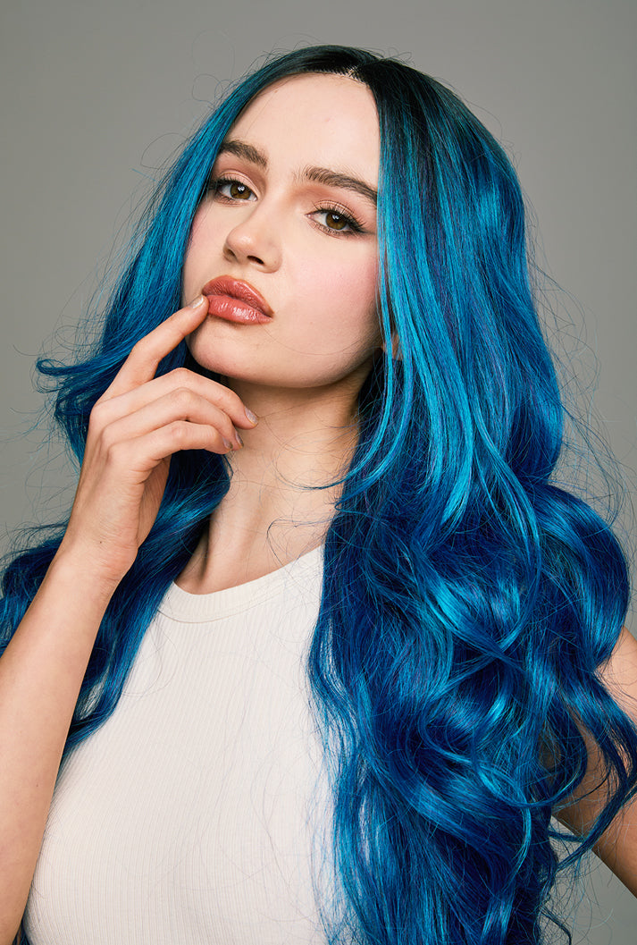 Light plays hide-and-seek in Chloe's blue spirals by Ailsa's Wigs - each wave a testament to premium fiber quality