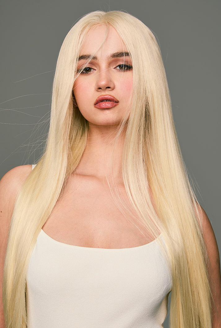 Full front view of Leah by Ailsa's Wigs, featuring 32-inch platinum blonde hair cascading below the waist, shimmering like sunset-tinted clouds.