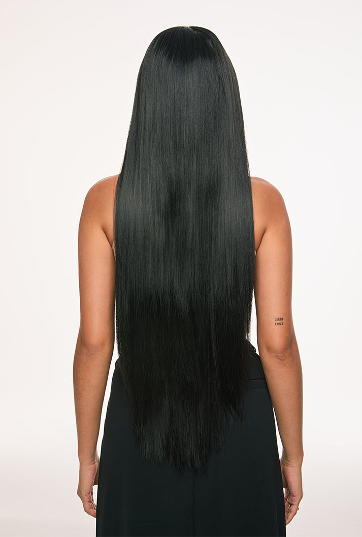 Back view of Clara wig by Ailsa's Wigs cascading to waist-length perfection with knife-edge straightness