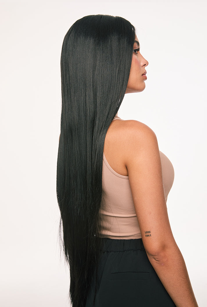 Clara wig by Ailsa's Wigs in motion capture, strands flowing like black satin ribbon in breeze