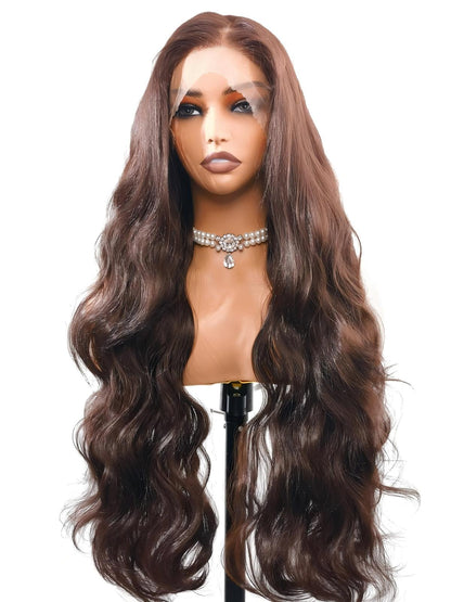 Susan by Ailsa's Wigs – Brown Black 28-Inch Wig in sunlight, golden highlights on chestnut-toned body waves, natural flow with 4-6cm waves.