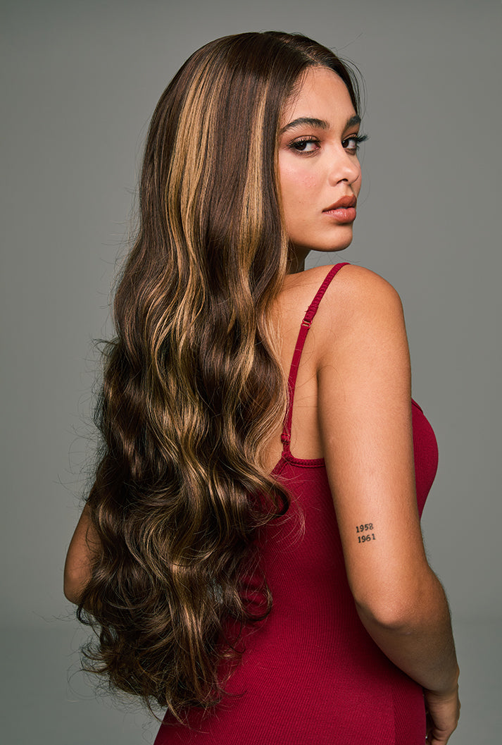 The Willow 28-inch highlighted mixed brown lace front wig by Ailsa's Wigs from the right rear view. The honey-brown highlights gently blend with the deep brown base, creating a warm, sophisticated look with a soft caramel glow when the light hits. Perfect for an elegant style.