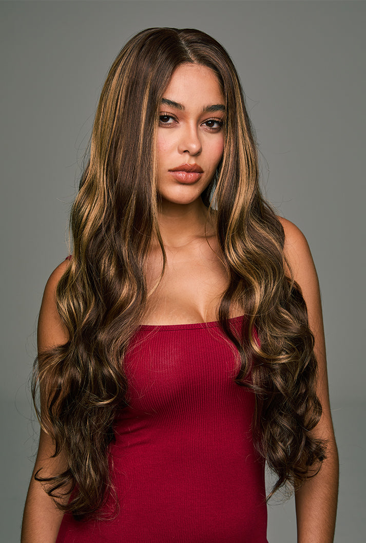 A close-up of the Willow 28-inch mixed brown lace front wig by Ailsa's Wigs, highlighting the soft, warm waves and subtle honey-brown highlights that add dimension and elegance to the style.