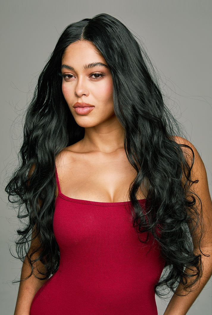 Piper 32-inch natural black loose wave hair wig by Ailsa's Wigs, front view with rich color and cold-toned blue-purple sheen. Loose waves create an elegant, vibrant look.